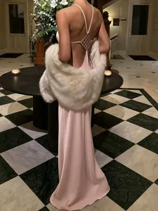 Elegant pink backless slip dress with rhinestone strap and luxury white fur stole for women.