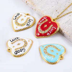 Heart-shaped stainless steel pendants with horseshoe design and 'Good Luck' engraving