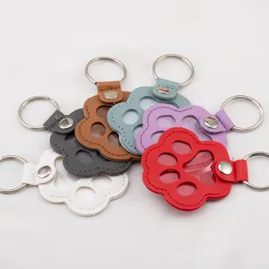 Paw-shaped leather keychains in vibrant colors for pet fur memorial and identification tags