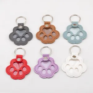 Paw shaped leather keychains for pet hair collection and memorial identification tags