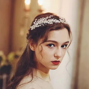 Elegant crystal vine bridal headpiece shown on a model for wedding hair styling detail