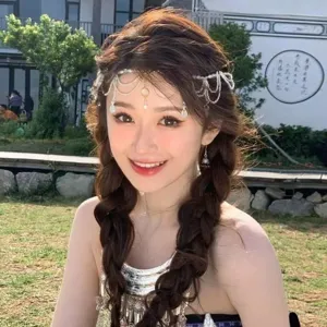 Elegant crystal water drop forehead chain accessory on model for bridal or Hanfu styling.