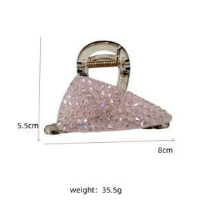 Macro view of pink crystal hair claw clip showing 8cm length and 35.5g weight details.