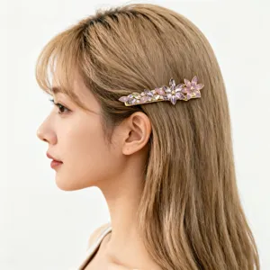Elegant side view of model wearing a purple crystal flower hair clip for hair styling.