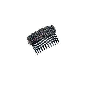 Close-up detail of faceted black and purple crystals on an elegant hair insert comb