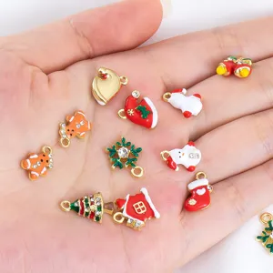 Variety of festive alloy Christmas charms in palm for DIY necklace and earring making