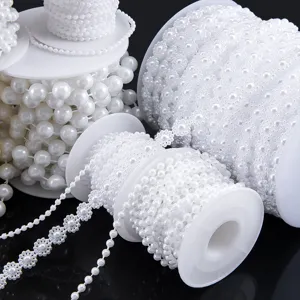Various sizes of white plastic pearl and sunflower bead chains for DIY jewelry crafts