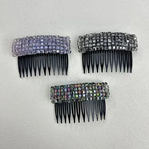 Detailed view of three sparkling crystal hair combs in purple, grey, and iridescent colors.