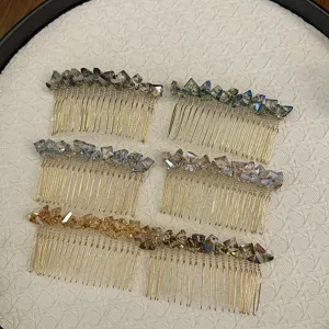 Macro view of six crystal beaded hair combs in various colors with gold metal teeth