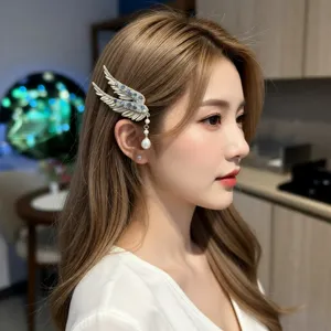 Model wearing an elegant angel wing hair clip with crystal tassels and pearls