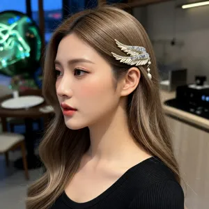 Elegant luxury angel wing hair clip with crystal rhinestones and pearl tassel detail