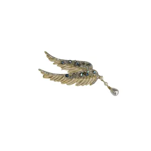 Elegant angel wing hair clip featuring crystal embellishments and a teardrop pearl tassel