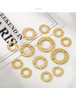 Detailed macro view of 18K gold plated textured round pendants for DIY jewelry crafts