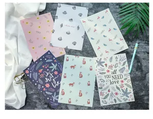 Juego de tarjetas de papelería de colores con diseños de flores, zorros y flamencos