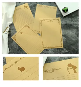 Close-up detail of vintage A5 kraft letter paper with rabbit and kid prints