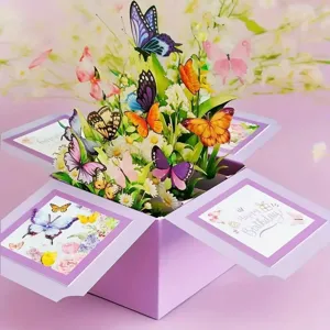 Detail showing the intricate 3D pop-up birthday card with colorful paper butterflies