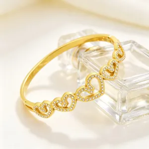 Bracelet jonc rigide acier titan cœur strass or détail cristal bijoux mode luxe femme
