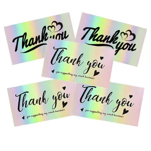 Macro view of holographic rainbow cards with Thank You message for small business