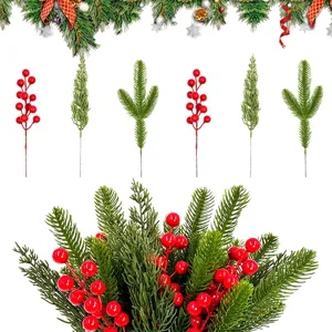 Artificial Christmas pine needles and red berry stems for DIY wreaths and holiday decor