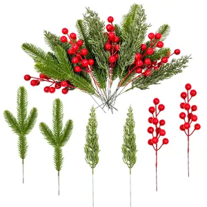 Set of artificial Christmas pine needles and red holly berry branches for DIY holiday wreaths