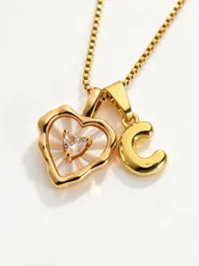 Gold stainless steel box chain necklace featuring mother-of-pearl heart and letter C pendant.