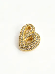 Gold paved bubble letter pendant detail shot, sparkling rhinestone fashion jewelry accessory.