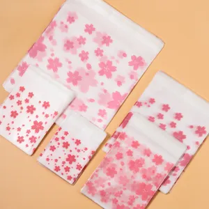 100pcs Pink Cherry Blossom matte translucent self-adhesive bags for cookies and snacks.