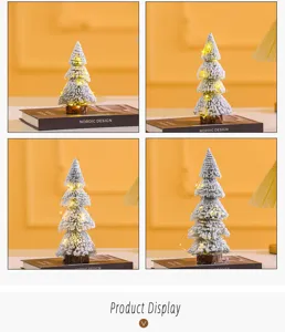 Detail view of mini flocked Christmas trees with warm LED lights on a Nordic book.