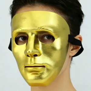 Detailed macro view of a shiny golden full-face masquerade mask for Halloween party costumes