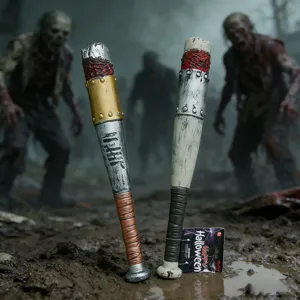 Close-up of weathered Halloween toy bats with realistic blood and rust effects.