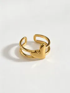 Close-up detail of 18K gold plated stainless steel open heart ring, modern geometric style.
