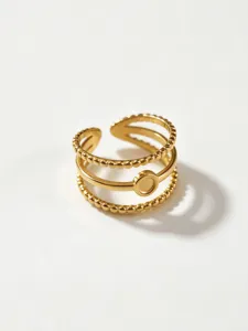 Detailed close-up of a trendy 18k gold stainless steel multi-layer stacked beaded ring.