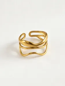 Gold geometric multi-strand wave hollow ring detail shot showcasing the unique design.