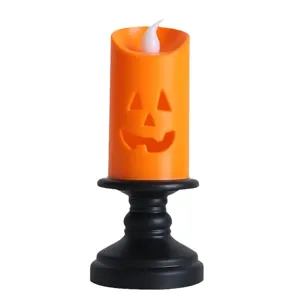 Halloween orange pumpkin LED candle light with black pedestal base for festive decor