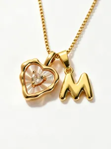 Gold stainless steel box chain necklace featuring a mother-of-pearl heart and letter M pendant.