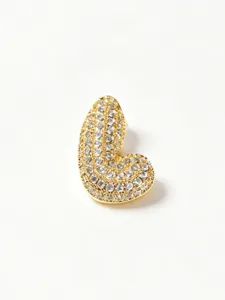 Closeup view of gold plated stainless steel rhinestone pave bubble letter pendant jewelry detail.