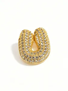 Exquisite iced out bubble letter pendant detail showing shimmering paved stones and gold finish.