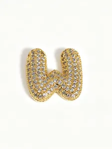 Gold pavé bubble letter pendant detail, sparkly stone encrusted initial charm necklace accessory.