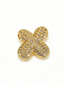 Gold-plated stainless steel pave rhinestone bubble letter X pendant detail, fashion jewelry.