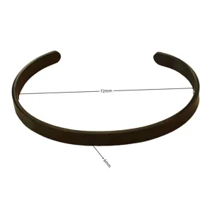 Detail view of a minimalist black stainless steel open cuff bracelet with size details.