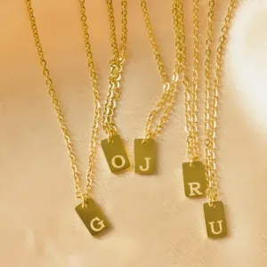 Gold stainless steel initial letter pendant necklace set featuring stylish square tags for women.