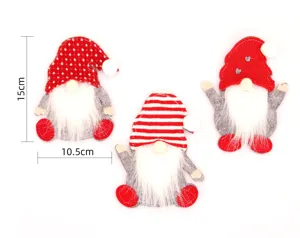 Detail view of three festive gnome cutlery holders showing 15cm height and 10.5cm width