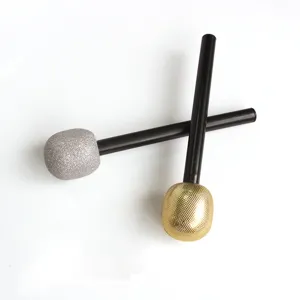 Detailed view of gold and silver toy microphones for children's performance props.