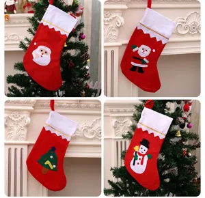 Detail showing different Christmas stocking designs with Santa and Snowman appliques.