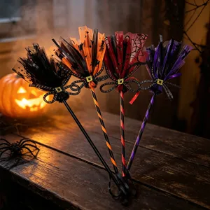 Detailed view of four colorful mesh Halloween witch brooms for kids costume party