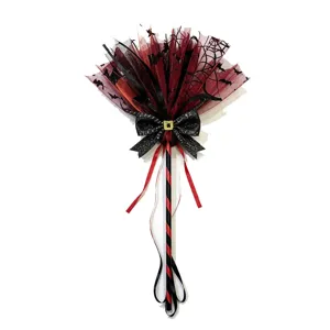 Detailed view of Halloween witch broom prop with red mesh and bat patterns for kids