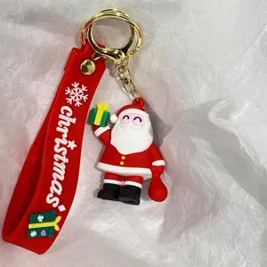 Nahaufnahme einer 3D-Weihnachtsmann-Figur und eines roten Silikon-Schlüsselanhängers