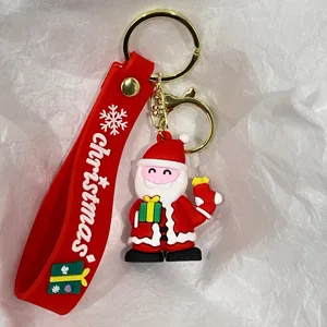 Nahaufnahme eines niedlichen Weihnachtsmann-Schlüsselanhängers mit rotem Band-Detail