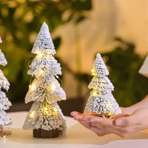 Mini flocked snowy cedar Christmas tree with warm LED lights for festive desktop decor