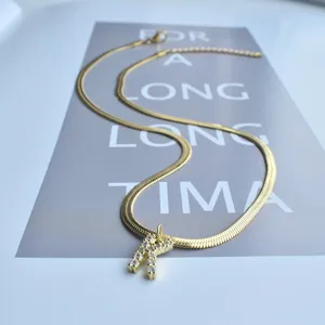 Gold herringbone chain necklace with sparkling zircon letter pendant for women fashion.